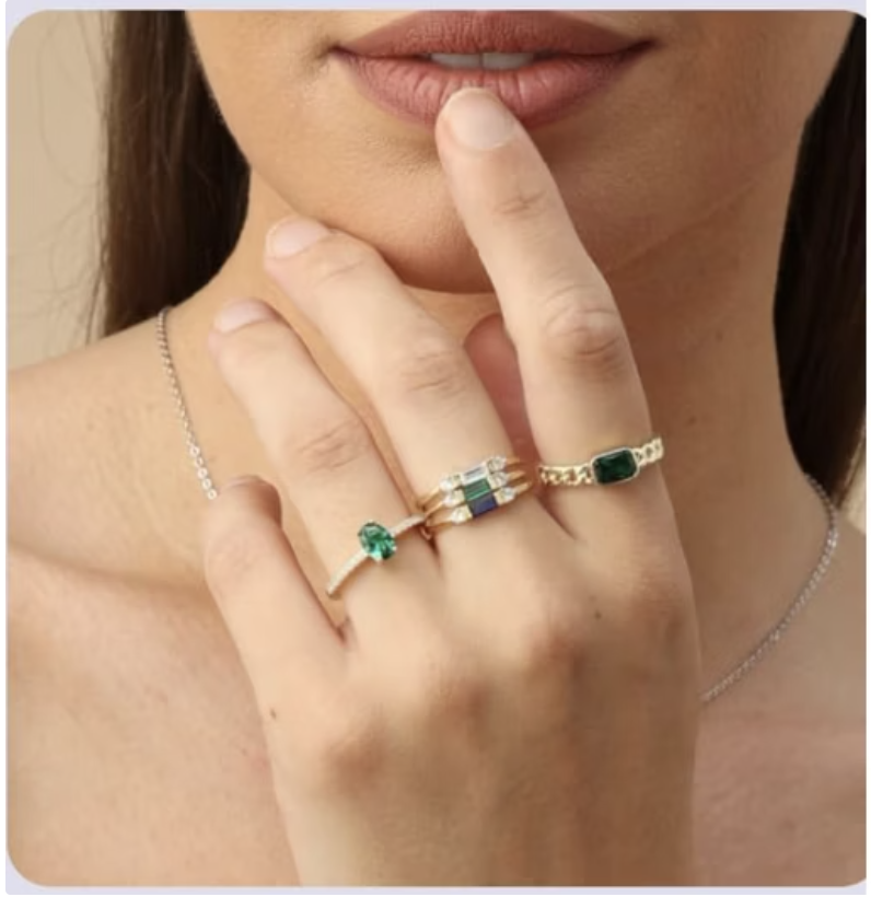 Luxury jewelry rings - Thoughtful pose showcasing elegant gemstone collection